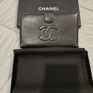 CHANEL Black Leather Piece with Iconic Emblem